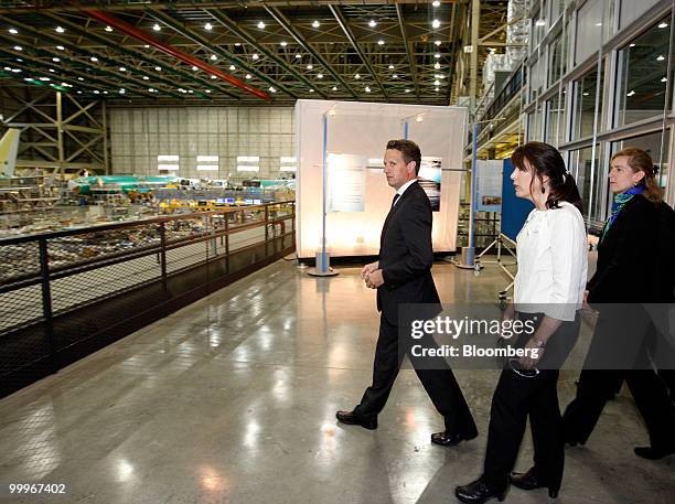 Timothy Geithner, U.S. Treasury secretary, left, tours a Boeing Co. Manufacturing facility in Renton, Washington, U.S., on Tuesday, May 18, 2010....