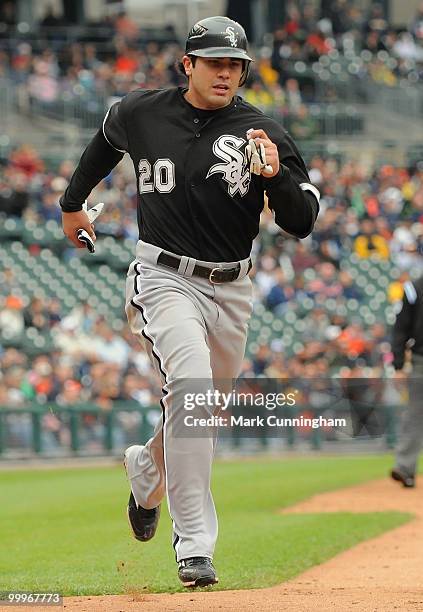 Carlos Quentin of the Chicago White Sox scores in the fourth inning on a double by teammate Juan Pierre during the game against the Detroit Tigers at...