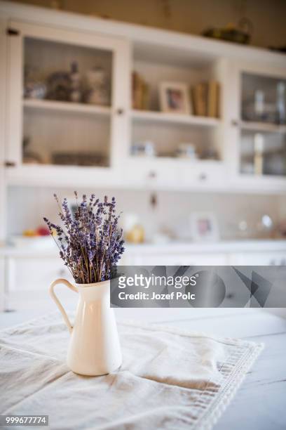 dried lavender bunch in a white vase in vintage kitchen. - jozef polc stock pictures, royalty-free photos & images