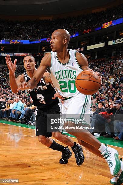 Ray Allen of the Boston Celtics moves the ball against George Hill of the San Antonio Spurs during the game on March 28, 2010 at the TD Garden in...