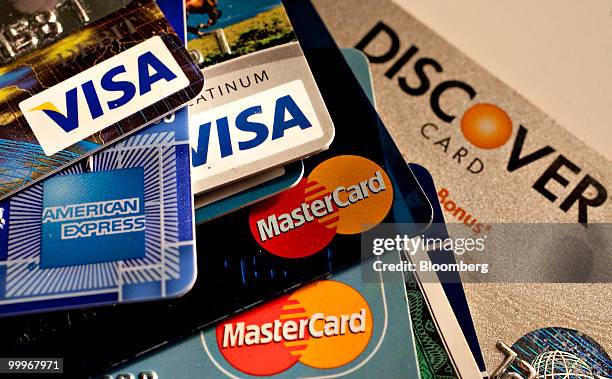 American Express, Discover, MasterCard and Visa credit cards are displayed for a photograph in New York, U.S., on Tuesday, May 18, 2010. Credit-card...