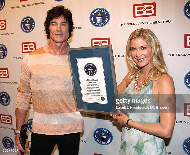 Actor Ronn Moss and actress Katherine Kelly Lang of the television show "The Bold and the Beautiful" attend the official Guinness World Record...
