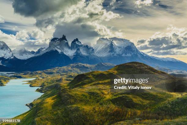 view of torres mountains in the torres del peine national park during sunrise. autumn in... - torres stockfoto's en -beelden