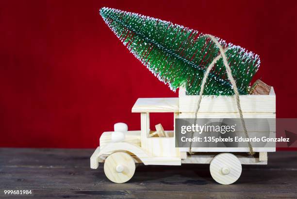 truck with christmas tree - modell stock pictures, royalty-free photos & images