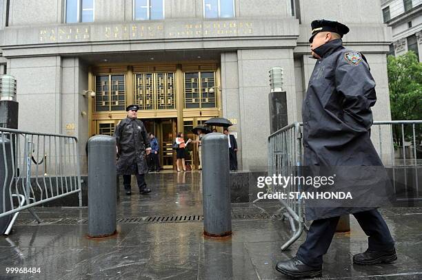 New York Police Department officers stand outside Federal Court in New York as Faizal Shahzad, the suspect in the attempt to set off a bomb in Times...