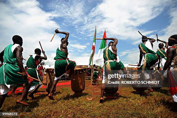 Burundi's Nkurunziza on God and grassroots development** Traditional Burundian drummers bounce unto their drums during a political rally by Burundian...