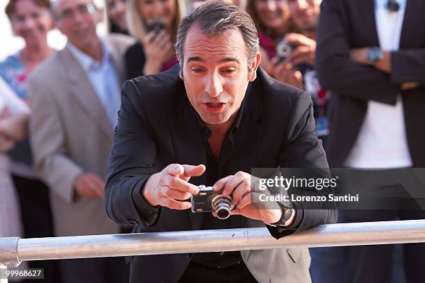 Jean Dujardin attends "Le Grand Journal" Show on Canal Plus at the Majestic Beach of Cannes on May 18, 2010 in Cannes, France.