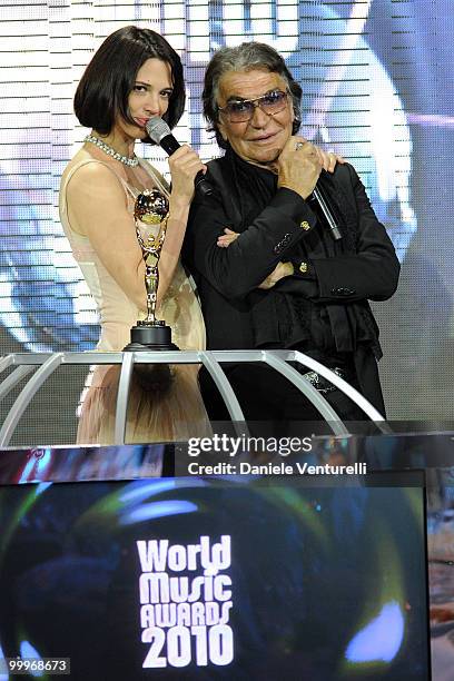 Designer Roberto Cavalli and Asia Argento speak onstage during the World Music Awards 2010 at the Sporting Club on May 18, 2010 in Monte Carlo,...