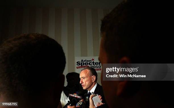 Sen. Arlen Specter talks with reporters while touring the site of his primary night gathering for staff and supporters May 18, 2010 in Philadelphia,...