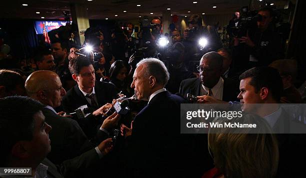 Sen. Arlen Specter talks with reporters while touring the site of his primary night gathering for staff and supporters May 18, 2010 in Philadelphia,...