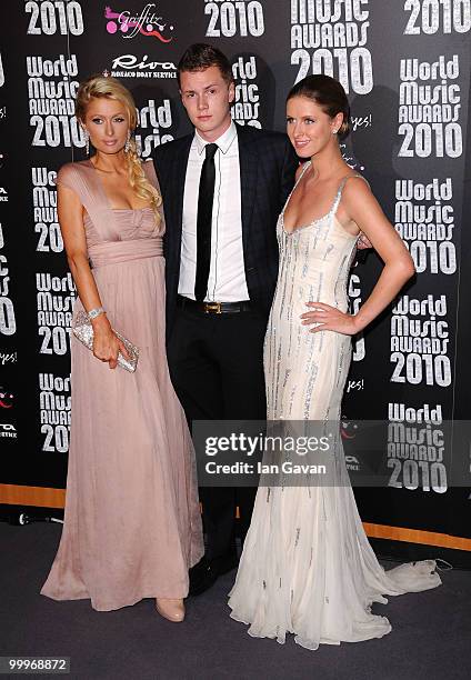 Barron Nicholas Hilton, Paris Hilton and Nicky Hilton pose in the press room during the World Music Awards 2010 at the Sporting Club on May 18, 2010...