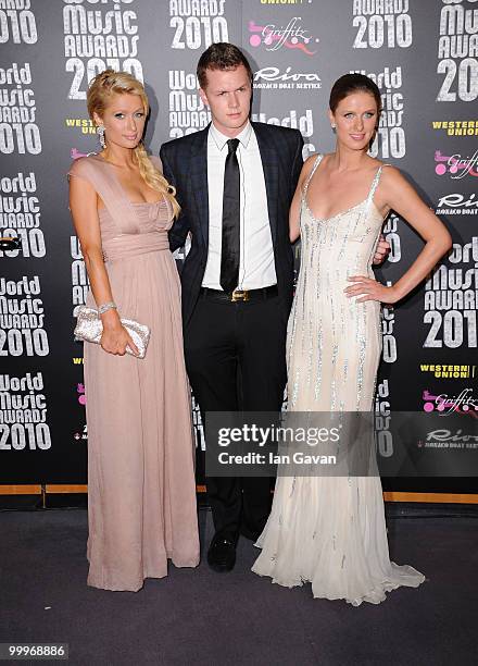 Barron Nicholas Hilton, Paris Hilton and Nicky Hilton pose in the press room during the World Music Awards 2010 at the Sporting Club on May 18, 2010...