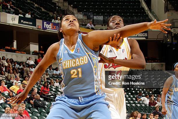 Abi Olajuwon of the Chicago Sky boxes out against Jessica Davenport of the Indiana Fever during the WNBA preseason game on May 7, 2010 at Conseco...