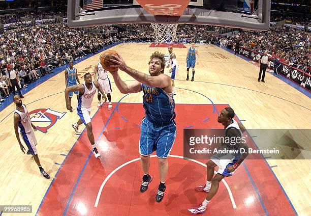 Aaron Gray of the New Orleans Hornets puts a shot up against the Los Angeles Clippers during the game at Staples Center on March 15, 2010 in Los...