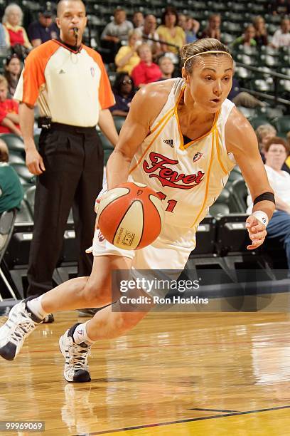 Tully Bevilaqua of the Indiana Fever drives against the Chicago Sky during the WNBA preseason game on May 7, 2010 at Conseco Fieldhouse in...