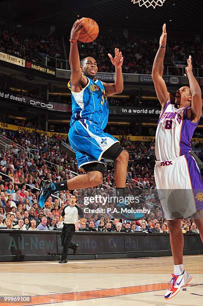 Marcus Thornton of the New Orleans Hornets makes a layup against Channing Frye of the New Orleans Hornets in an NBA Game played on March 14, 2010 at...