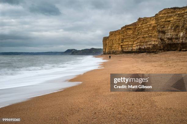 beautiful vibrant sunset landscape image of burton bradstock gol - gol stock pictures, royalty-free photos & images