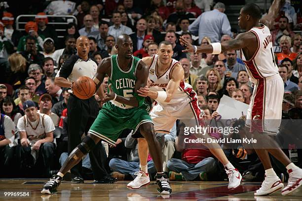 Kevin Garnett of the Boston Celtics looks to pass around Anthony Parker and Antawn Jamison of the Cleveland Cavaliers in Game Five of the Eastern...