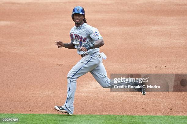 Jose Reyes of the New York Mets runs to third base during a MLB game against the Florida Marlins in Sun Life Stadium on May 16, 2010 in Miami,...