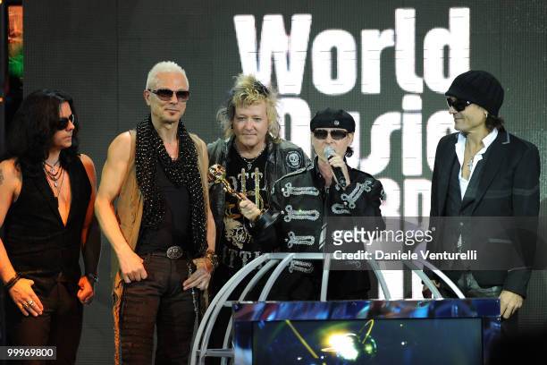 Musicians Pawel Maciwoda, Rudolf Schenker, James Kottak, Klaus Meine and Matthias Jabs of the band Scorpions perform onstage during the World Music...