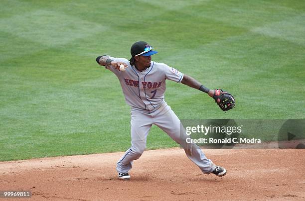 Jose Reyes of the New York Mets throws to first base during a MLB game against the Florida Marlins in Sun Life Stadium on May 16, 2010 in Miami,...