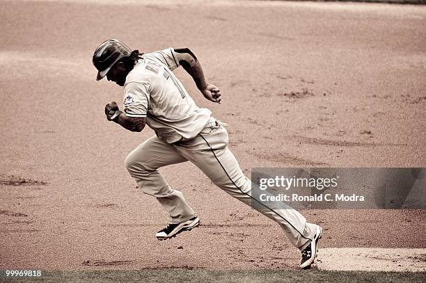 Jose Reyes of the New York Mets runs to third base during a MLB game against the Florida Marlins in Sun Life Stadium on May 16, 2010 in Miami,...