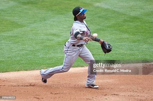 Jose Reyes of the New York Mets throws to first base during a MLB game against the Florida Marlins in Sun Life Stadium on May 16, 2010 in Miami,...