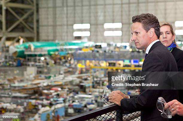 Treasury Secretary Timothy Geithner looks over the production line during a tour of the Boeing 737 plant May 18, 2010 in Renton, Washington. In the...