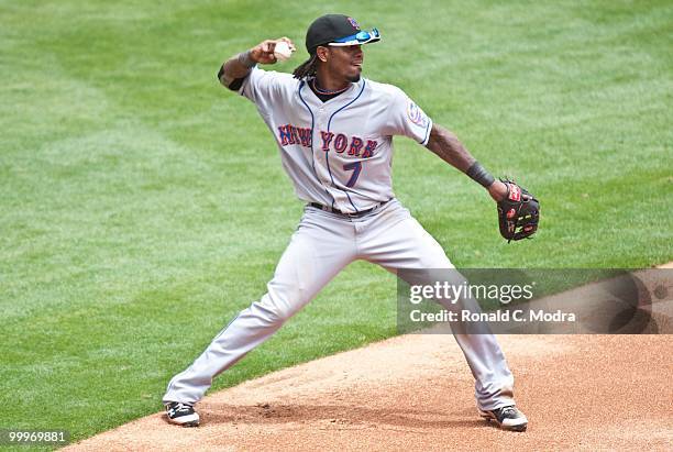 Jose Reyes of the New York Mets throws to first base during a MLB game against the Florida Marlins in Sun Life Stadium on May 16, 2010 in Miami,...