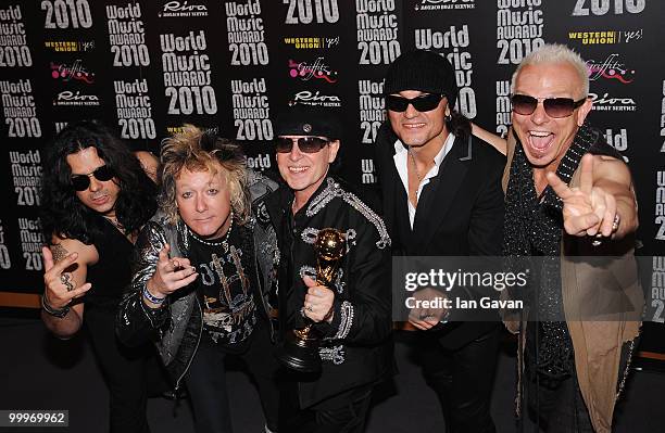 Pawel Maciwoda, James Kottak, Klaus Meine, Matthias Jabs and Rudolf Schenker of Scorpions with their award during the World Music Awards 2010 at the...