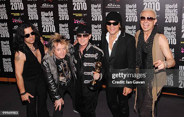 Pawel Maciwoda, James Kottak, Klaus Meine, Matthias Jabs and Rudolf Schenker of Scorpions with their award during the World Music Awards 2010 at the...