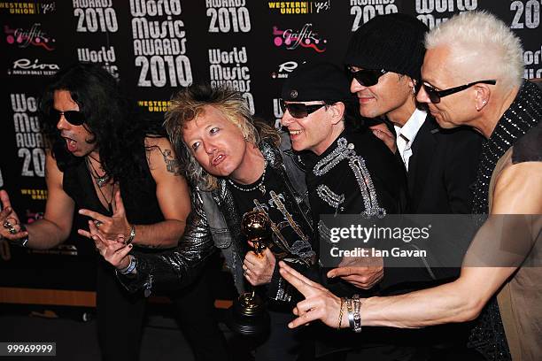 Pawel Maciwoda, James Kottak, Klaus Meine, Matthias Jabs and Rudolf Schenker of Scorpions with their award during the World Music Awards 2010 at the...