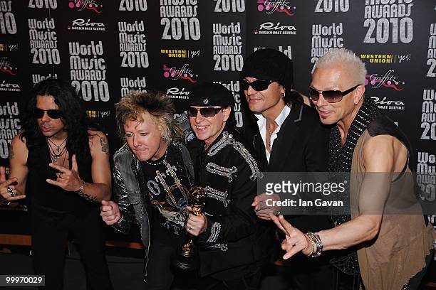 Pawel Maciwoda, James Kottak, Klaus Meine, Matthias Jabs and Rudolf Schenker of Scorpions with their award during the World Music Awards 2010 at the...