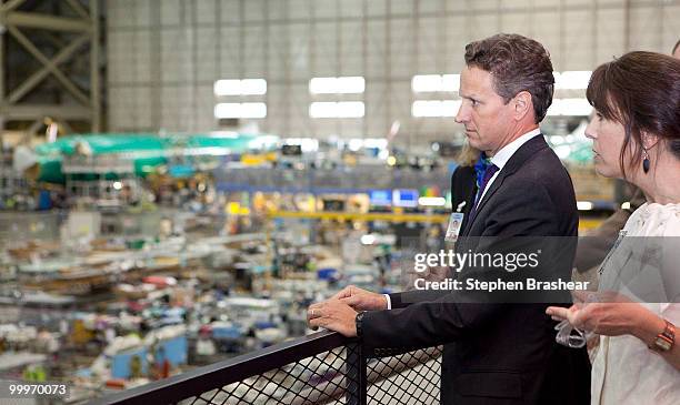 Treasury Secretary Timothy Geithner looks over the assembly line of the Boeing 737 plant on a tour by Boeing Vice President General Manager of 737...