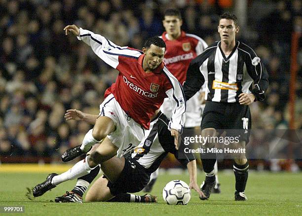 Jermaine Pennant of Arsenal breaks through the Grimsby defence during the Worthington Cup Fourth Round match between Arsenal and Grimsby Town at...