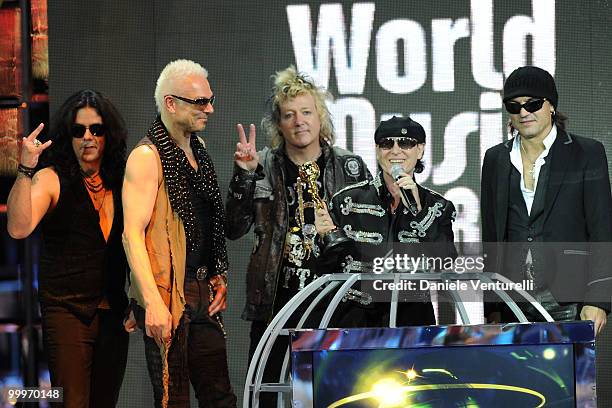 Pawel Maciwoda,Rudolf Schenker, James Kottak, Klaus Meine and Matthias Jabs perform on stage during the World Music Awards 2010 at the Sporting Club...