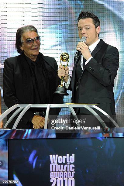 Designer Roberto Cavalli and Tiziano Ferro speak onstage during the World Music Awards 2010 at the Sporting Club on May 18, 2010 in Monte Carlo,...