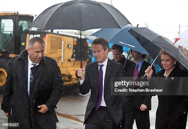 Treasury Secretary Timothy Geithner gets a tour of the Port of Tacoma from interim Executive Director John Wolfe and Washington state Gov. Chris...