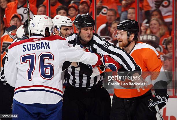 Linesman Greg Devorski separates Claude Giroux of the Philadelphia Flyers and PK Subban of the Montreal Canadiens after a scrum in Game Two of the...