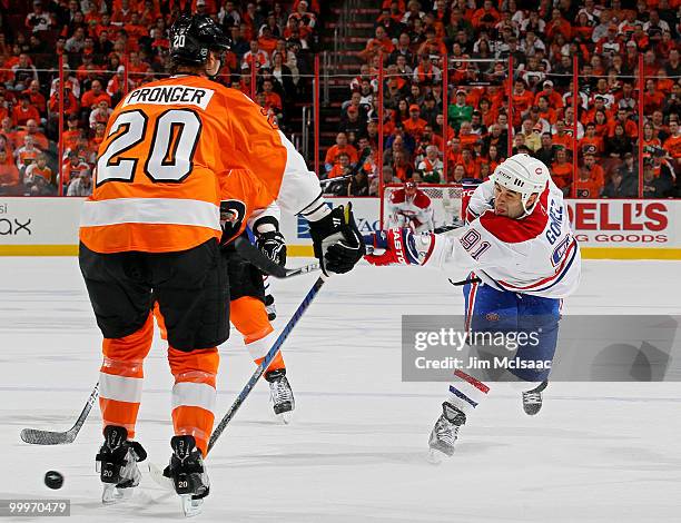 Scott Gomez of the Montreal Canadiens shoots against Chris Pronger of the Philadelphia Flyers in Game 2 of the Eastern Conference Finals during the...