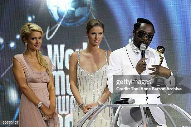 Paris Hilton , Nicky Hilton and Will I.A.M. Speak onstage during the World Music Awards 2010 at the Sporting Club on May 18, 2010 in Monte Carlo,...
