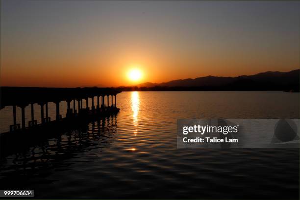 the sunset above the lake - lam stock pictures, royalty-free photos & images