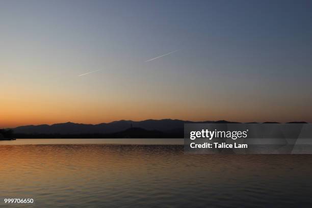 the sunset above the lake - lam stock pictures, royalty-free photos & images