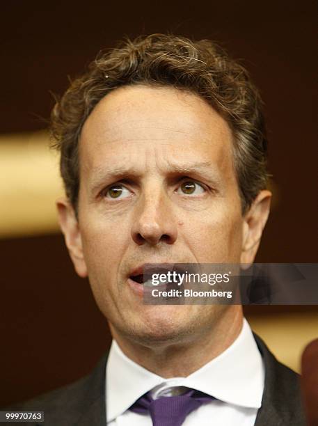 Timothy Geithner, U.S. Treasury secretary, speaks to reporters after a tour of the Port of Tacoma Marine Terminal in Tacoma, Washington, U.S., on...