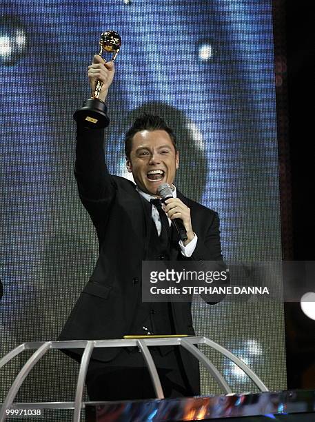 Tiziano Ferro receives an award during the World Music Awards in Monaco on May 18, 2010. The World Music Awards honour the world's top selling acts...