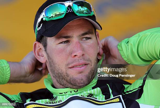 Mark Cavendish of Great Britain and riding for HTC-Columbia puts on the points leader jersey after he defended it during Stage Three of the 2010 Tour...