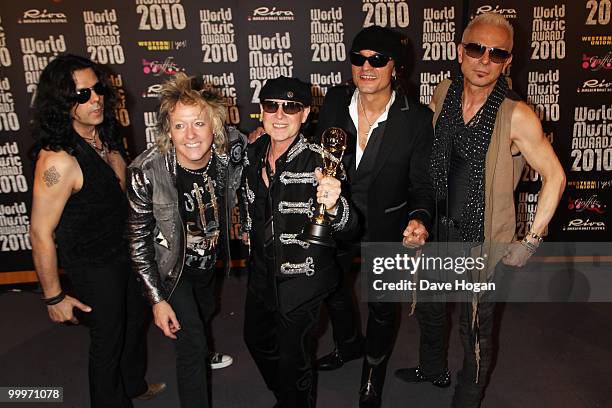 Musicians James Kottak, Matthias Jabs, Klaus Meine, Rudolf Schenker and Pawel Maciwoda of Scorpions pose in the press room at the World Music Awards...