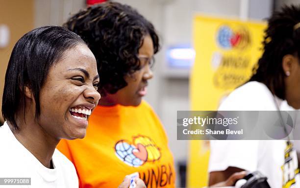 Players from the Tulsa Shock volunteer at the Community Food Bank of Eastern Oklahoma on May 13, 2010 in Tulsa, Oklahoma. NOTE TO USER: User...