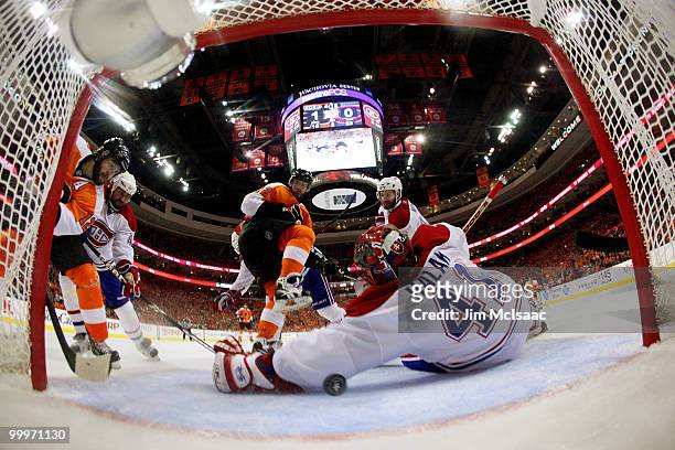 Jaroslav Halak of the Montreal Canadiens gives up a goal to Simon Gagne of the Philadelphia Flyers in the second period as Ville Leino looks on in...