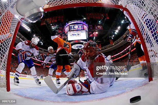 Jaroslav Halak of the Montreal Canadiens gives up a goal to Simon Gagne of the Philadelphia Flyers in the second period as Ville Leino celebrates in...